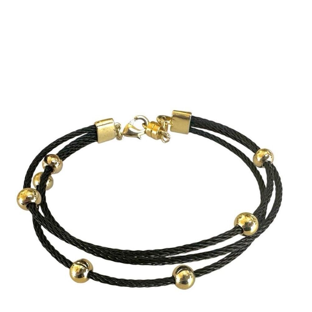 Black multi strand gold tone beaded bracelet